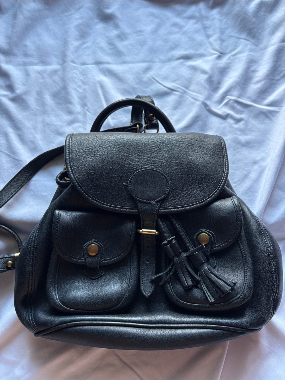 Dooney & Bourke Black Leather Backpack with Tassels